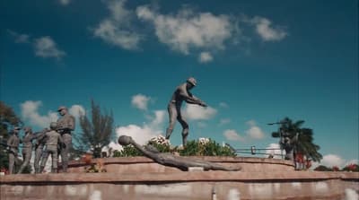 a statue of a man throwing a baseball