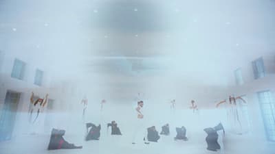 a group of people standing around in a room