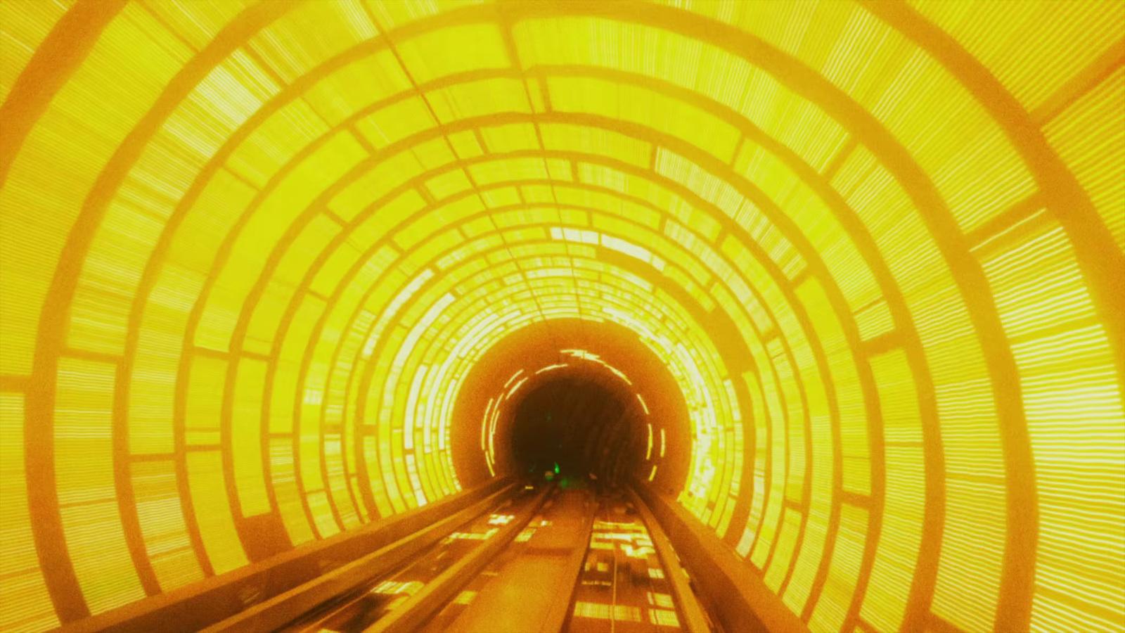a tunnel with a train going through it