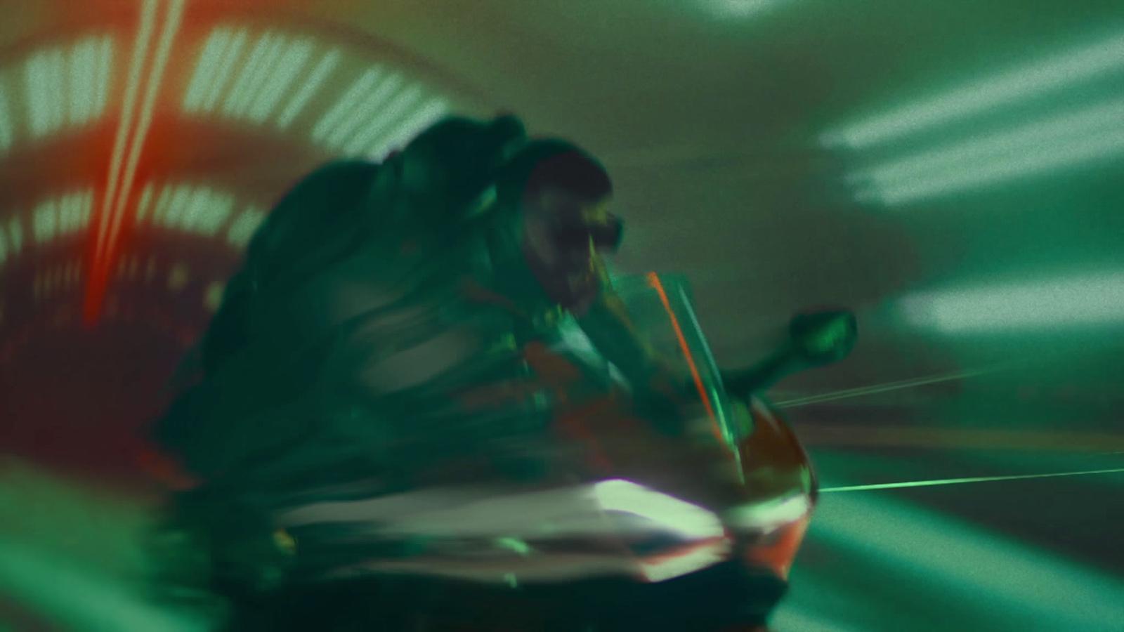 a blurry photo of a man riding a motorcycle