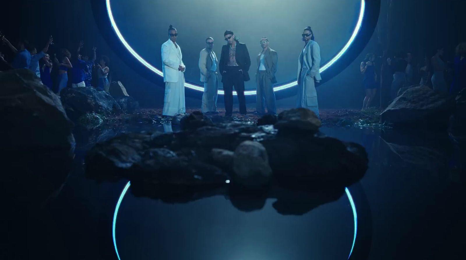 a group of people standing in a dark room