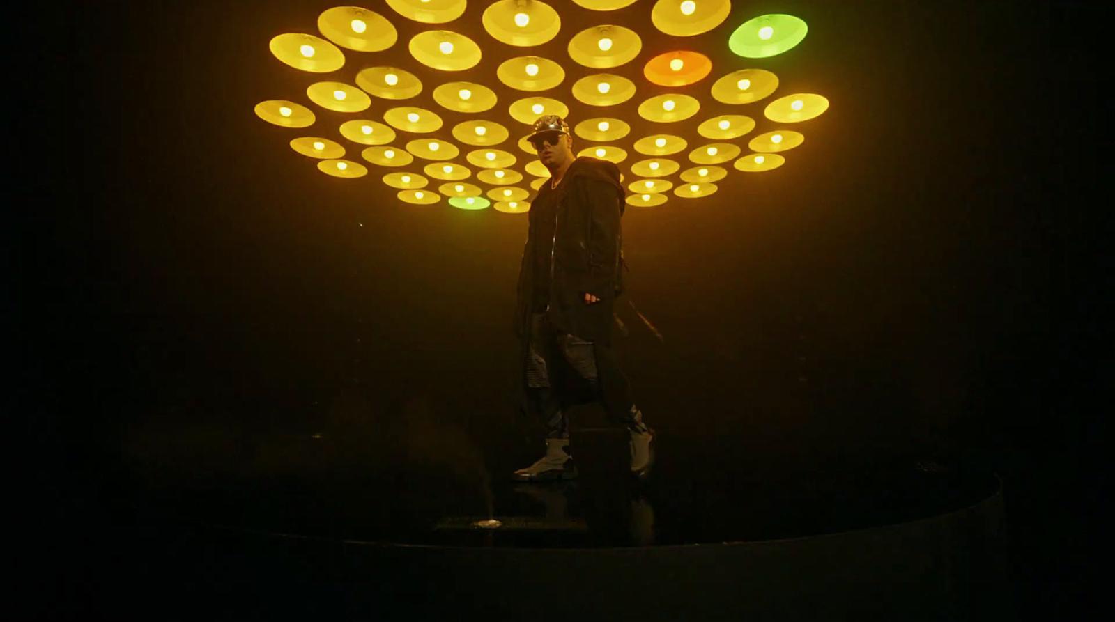 a person standing in front of a light fixture