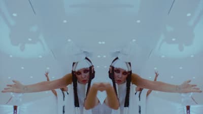 a reflection of a woman in a mirror