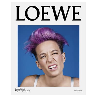 a woman with purple hair is featured in a magazine