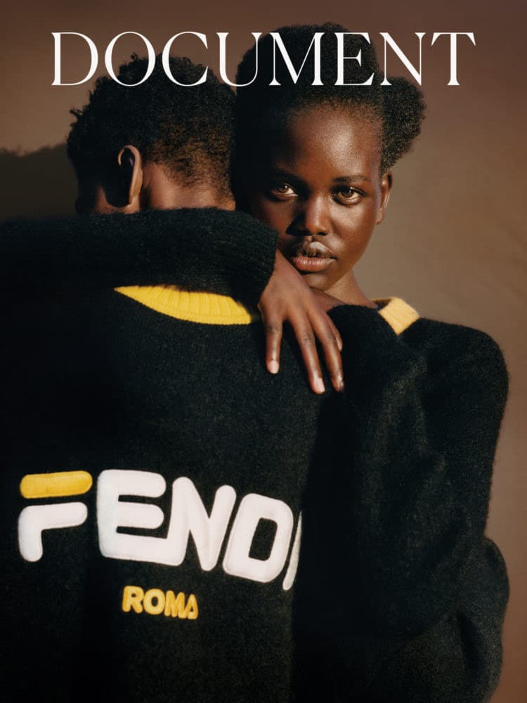 a man and woman embracing each other on the cover of a magazine
