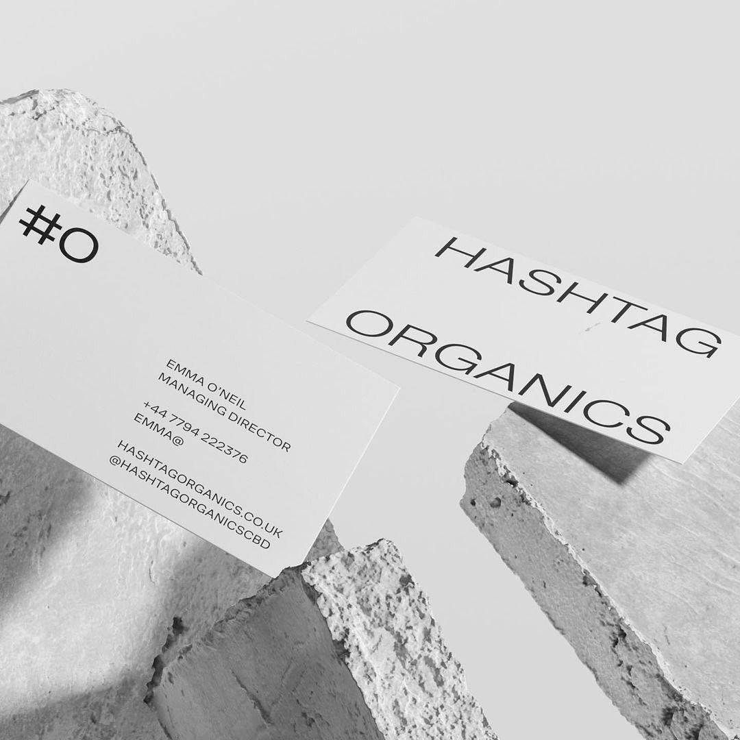 two business cards with hashtags on them