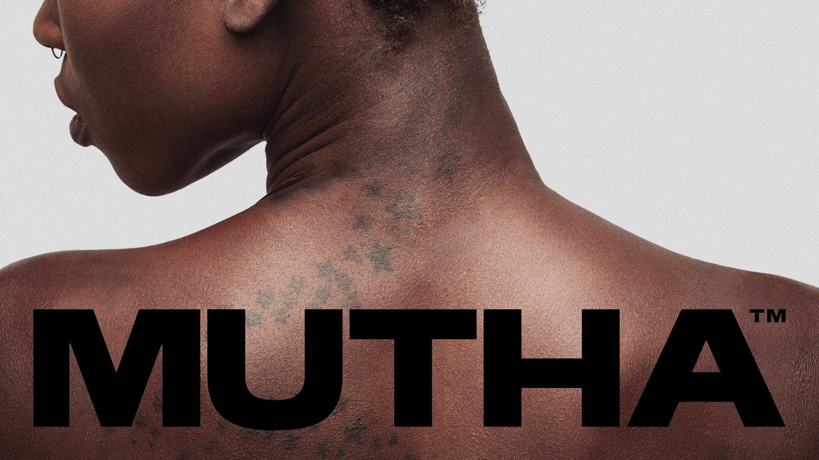 the back of a woman's neck with the words ahtum on it