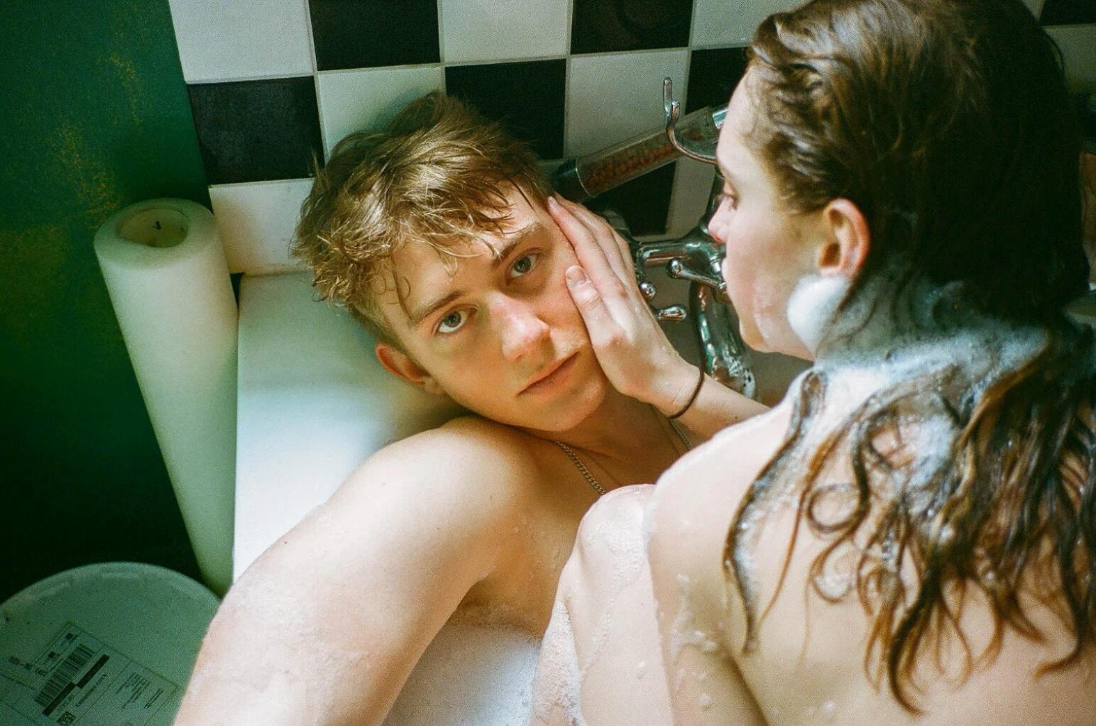 a couple of people that are in a bath tub