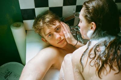 a couple of people that are in a bath tub