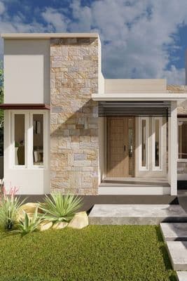 a modern house with a stone facade and a green lawn