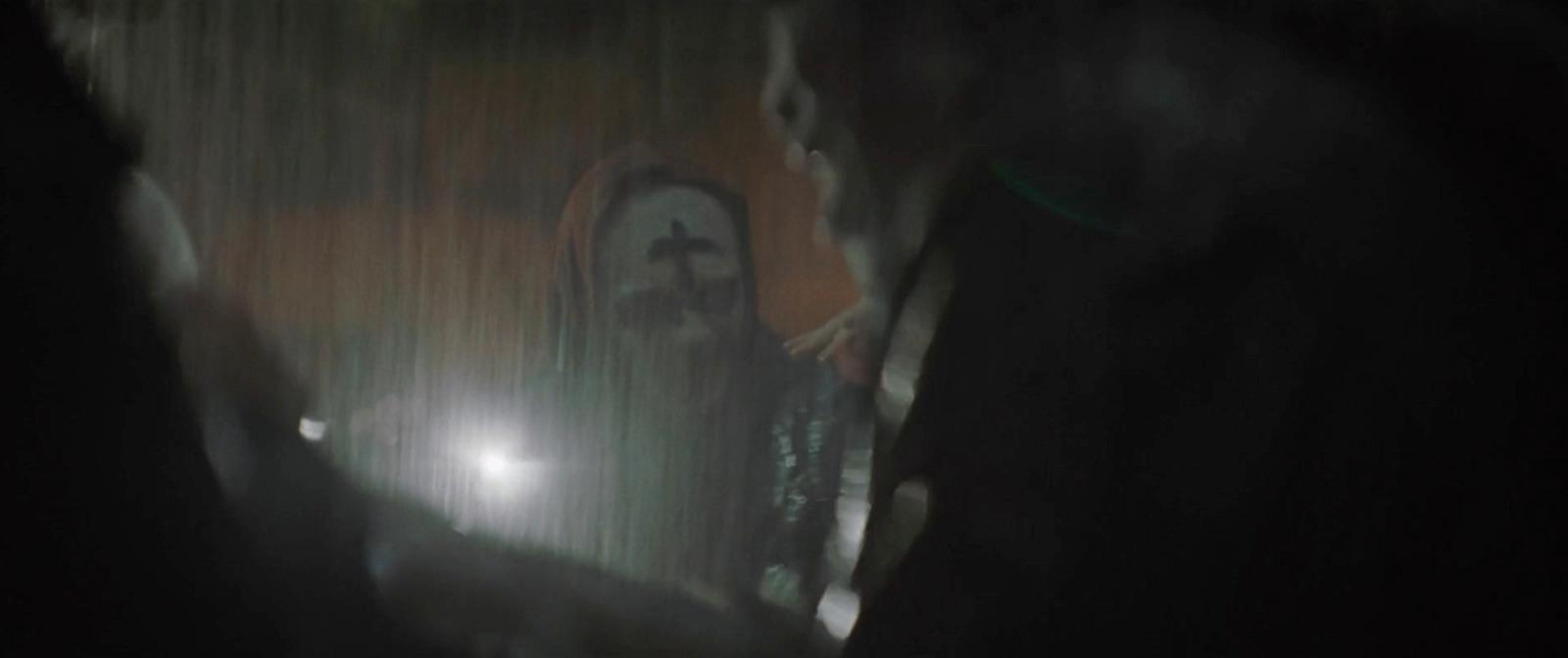 a blurry photo of a person holding a cell phone
