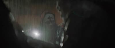 a blurry photo of a person holding a cell phone