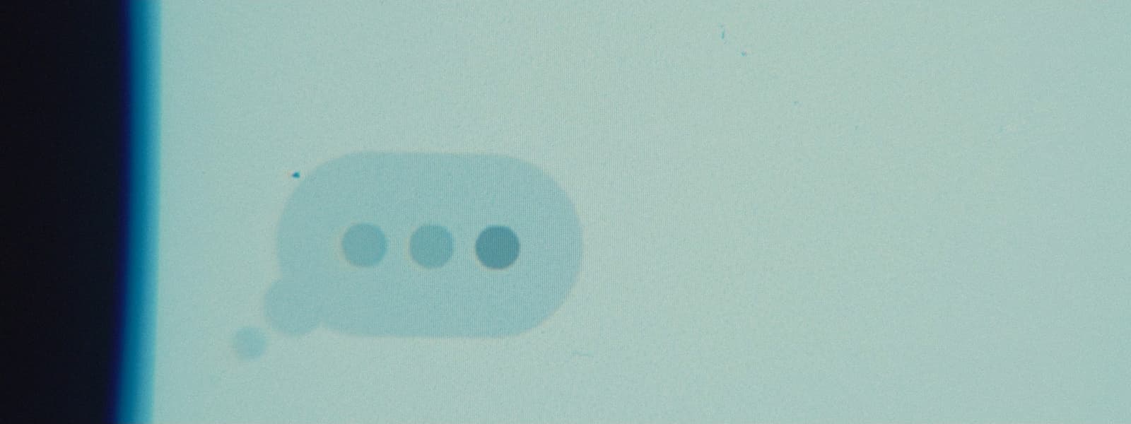 a shadow of a speech bubble on a wall