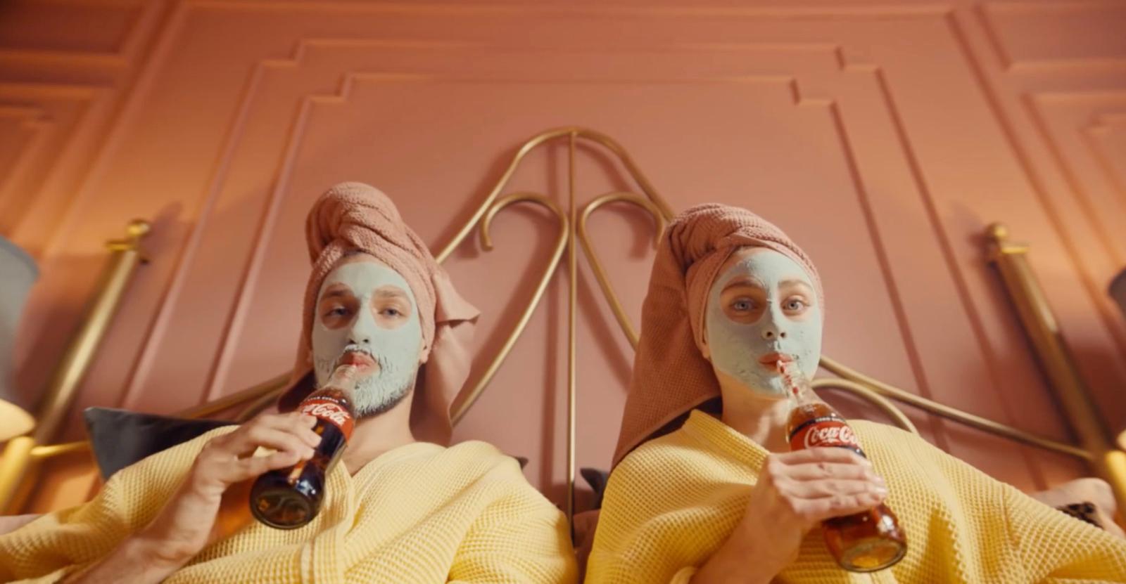 a couple of people that are sitting on a bed