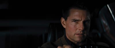 a man driving a car in the dark