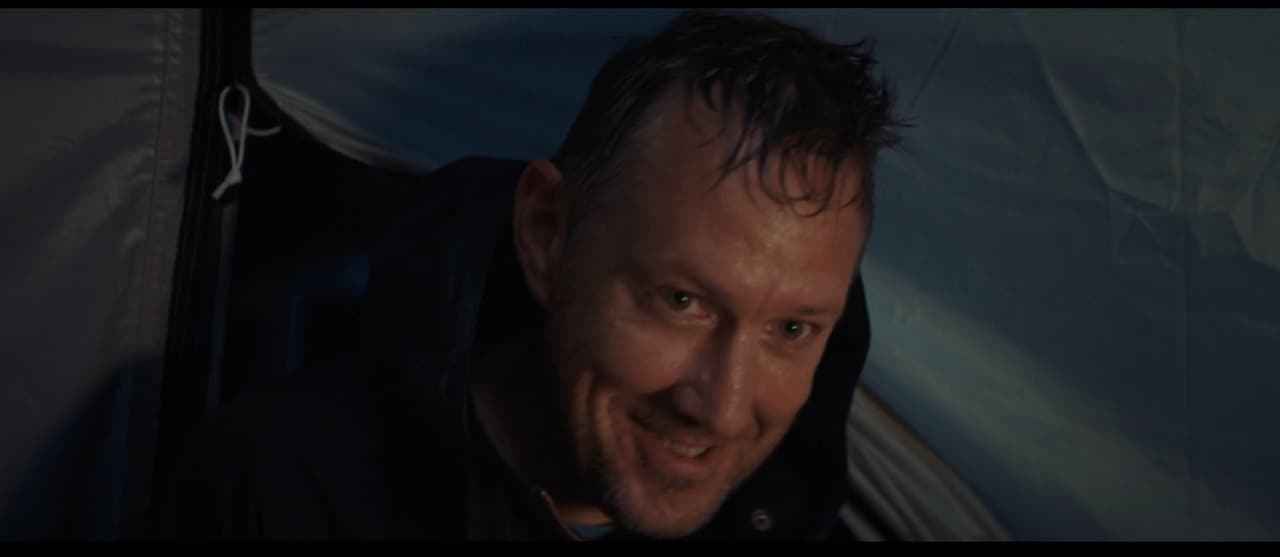 a close up of a person wearing a black jacket