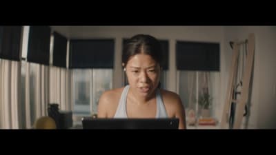 a woman looking at a laptop computer screen