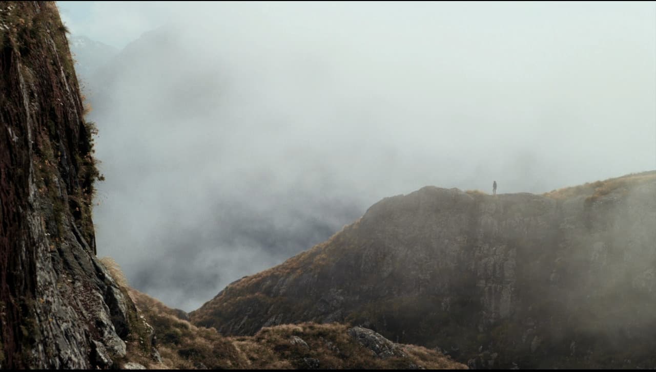 a person standing on top of a mountain