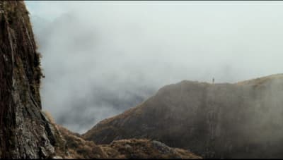 a person standing on top of a mountain