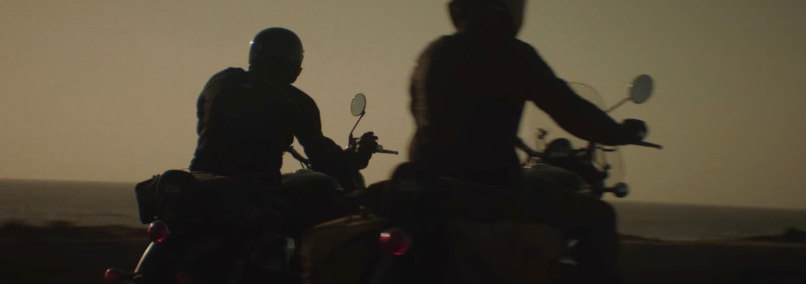 a couple of people that are on motorcycles