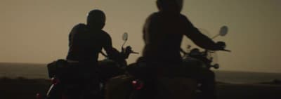 a couple of people that are on motorcycles