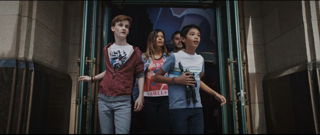 a group of young people standing outside of a building