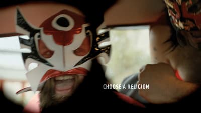 a man wearing a mask with a fish on it