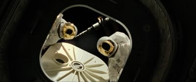 a close up of a pair of scissors on a piece of machinery