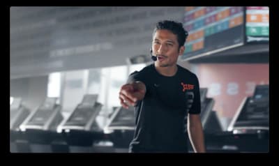 a man in a black shirt is holding a ball