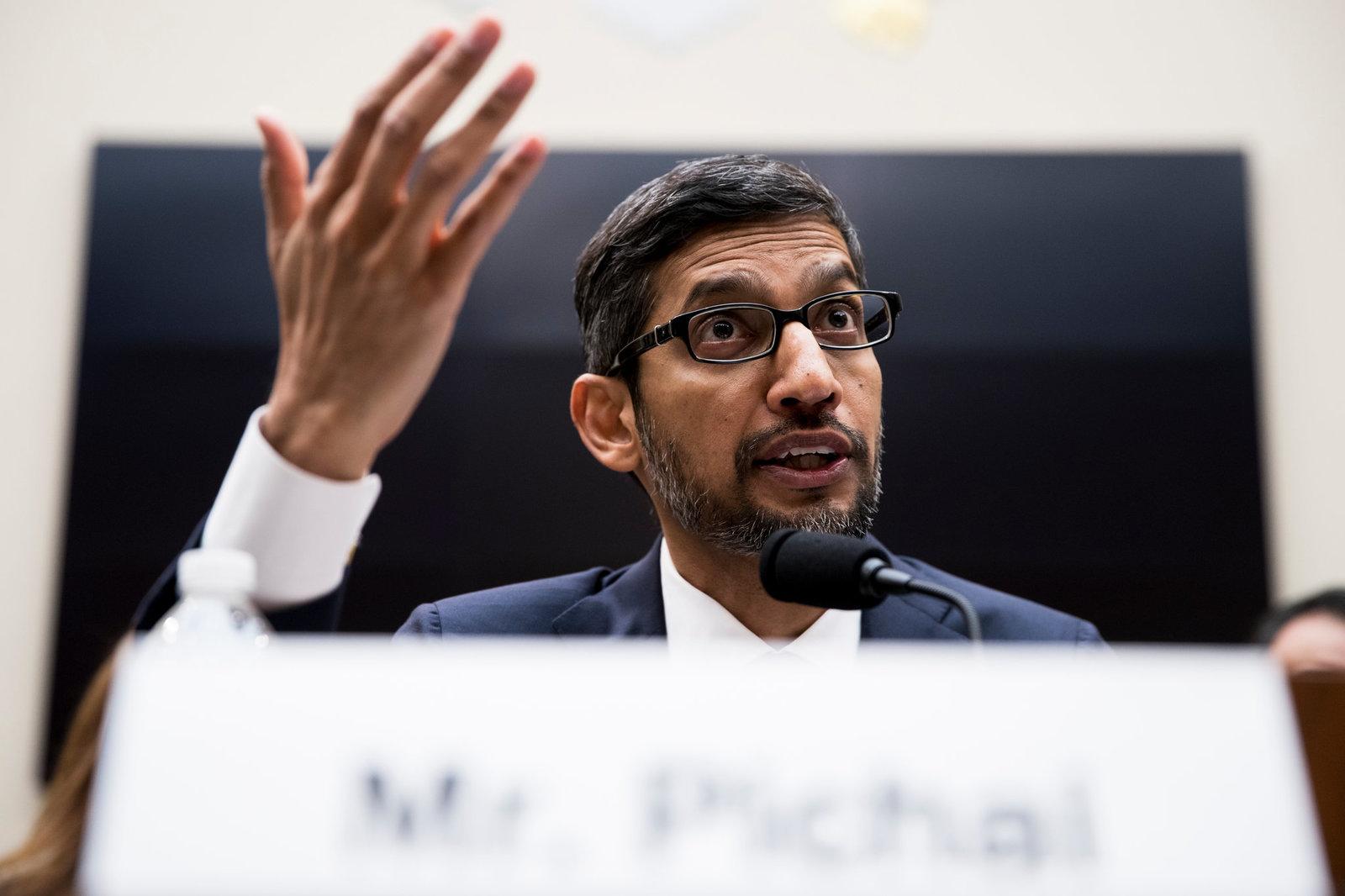 a man in a suit and tie giving a speech