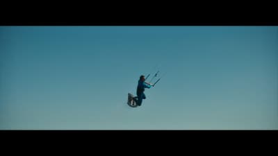 a man flying through the air while riding skis