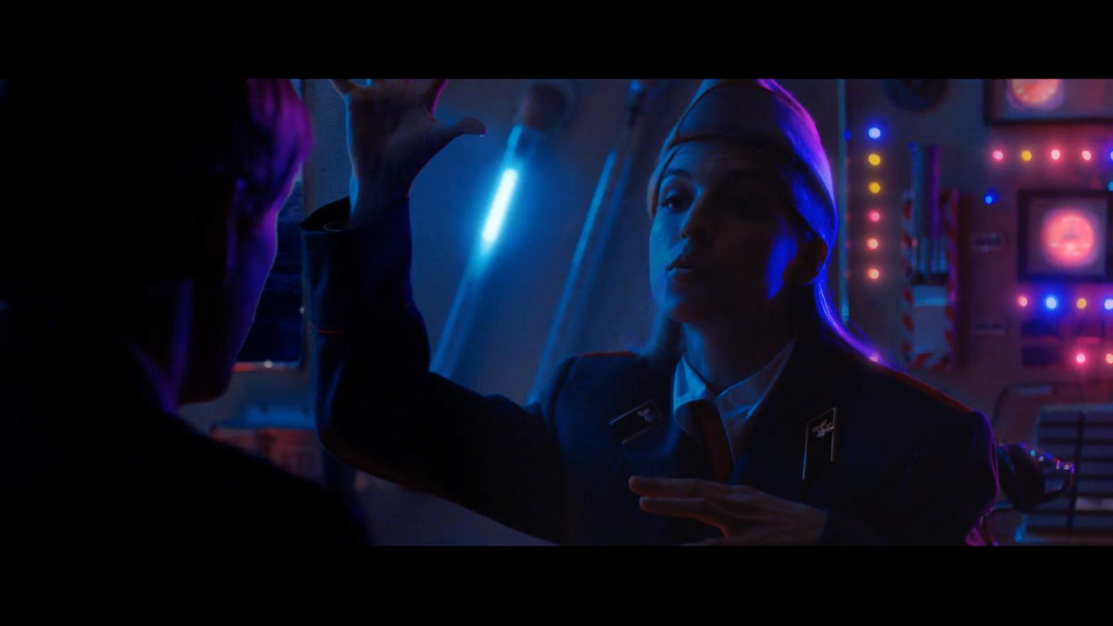 a man standing next to a woman in a room