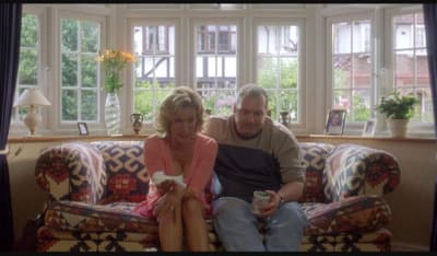 a man and a woman sitting on a couch