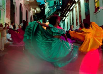 a group of people dancing in a street
