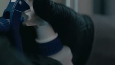 a close up of a mannequin's head with a hairdryer