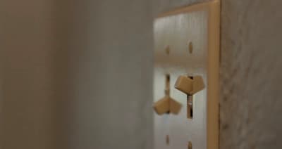 a close up of a light switch on a wall