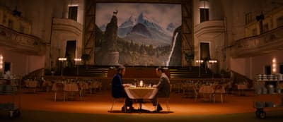 a couple of people standing at a table