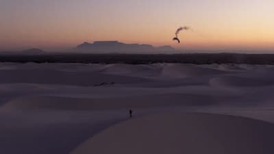 a person standing in the middle of a desert