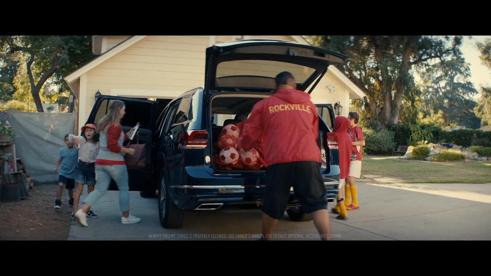 a group of people getting into a car