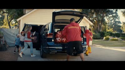 a group of people getting into a car