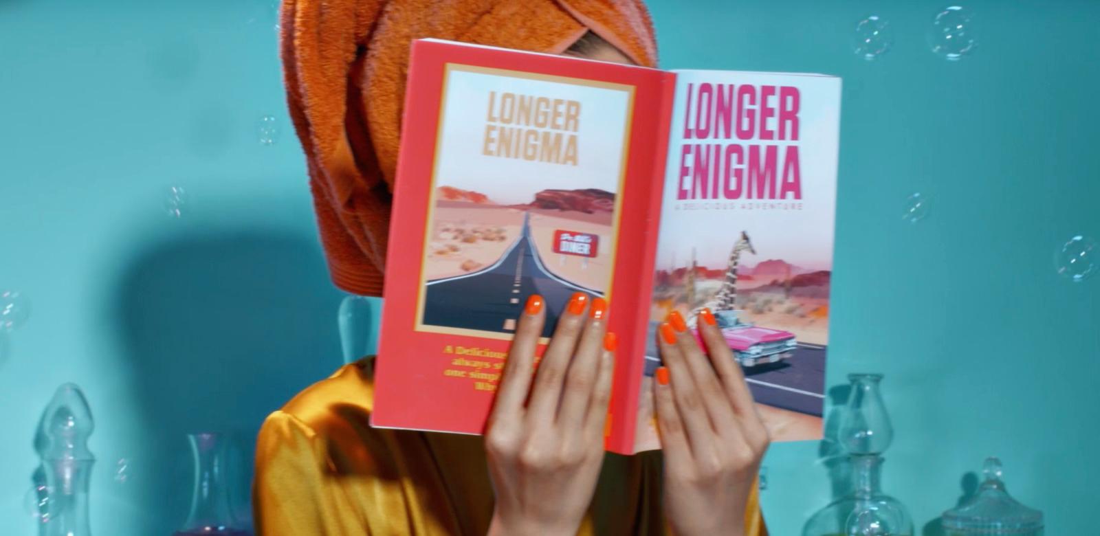 a woman holding two books in front of her face
