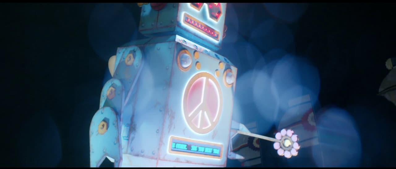 a toy robot with a peace sign on it's back