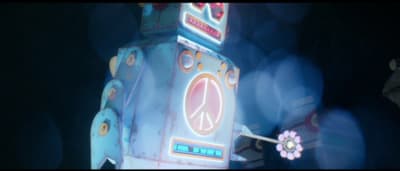 a toy robot with a peace sign on it's back