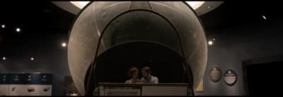 a couple of women standing next to each other in a room