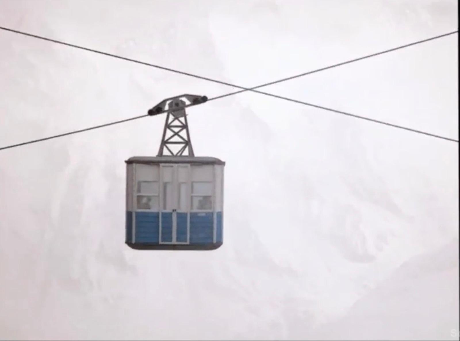 a ski lift with a sky lift in the background