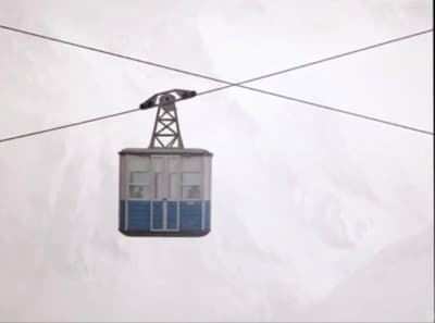 a ski lift with a sky lift in the background