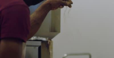a man is holding something in his hand