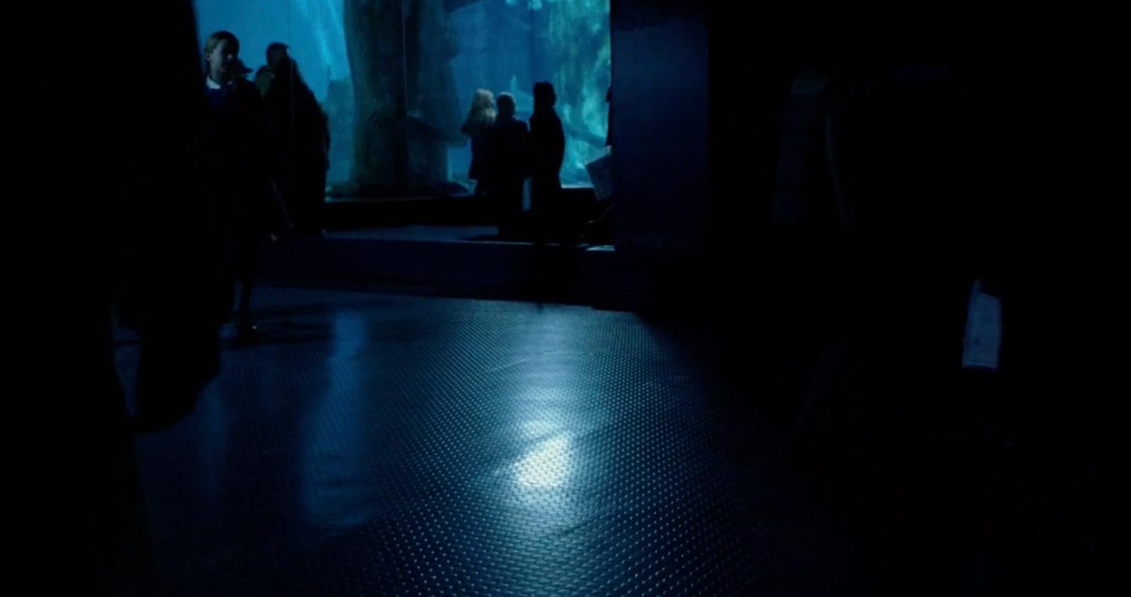 a group of people standing in a dark room