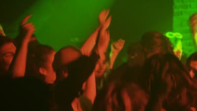 a group of people standing on top of a stage