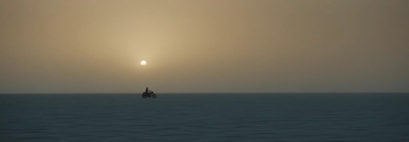 a lone boat in the middle of a large body of water